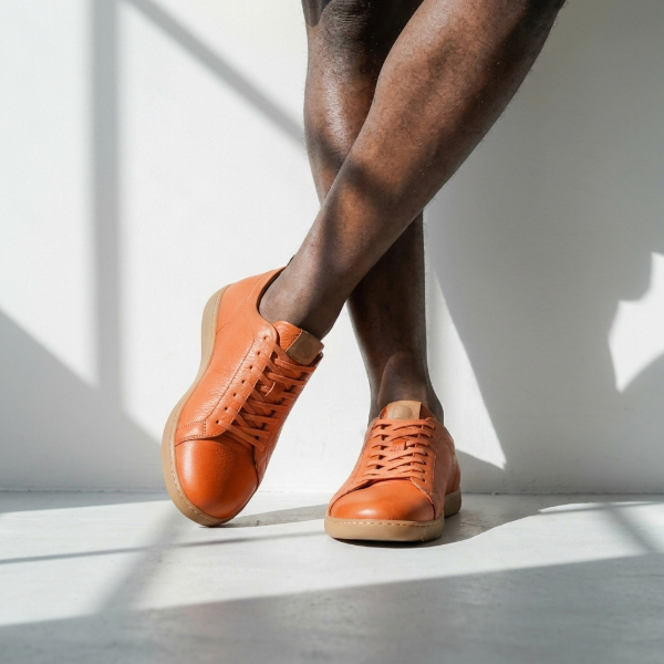 lightweight & flexible full grain leather sneakers in orange color