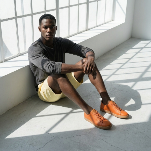 lightweight & flexible full grain leather sneakers in orange color